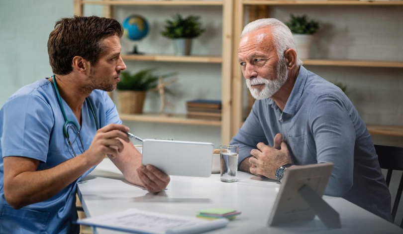 A trained caregiver helping an elderly resident at a premium facility.